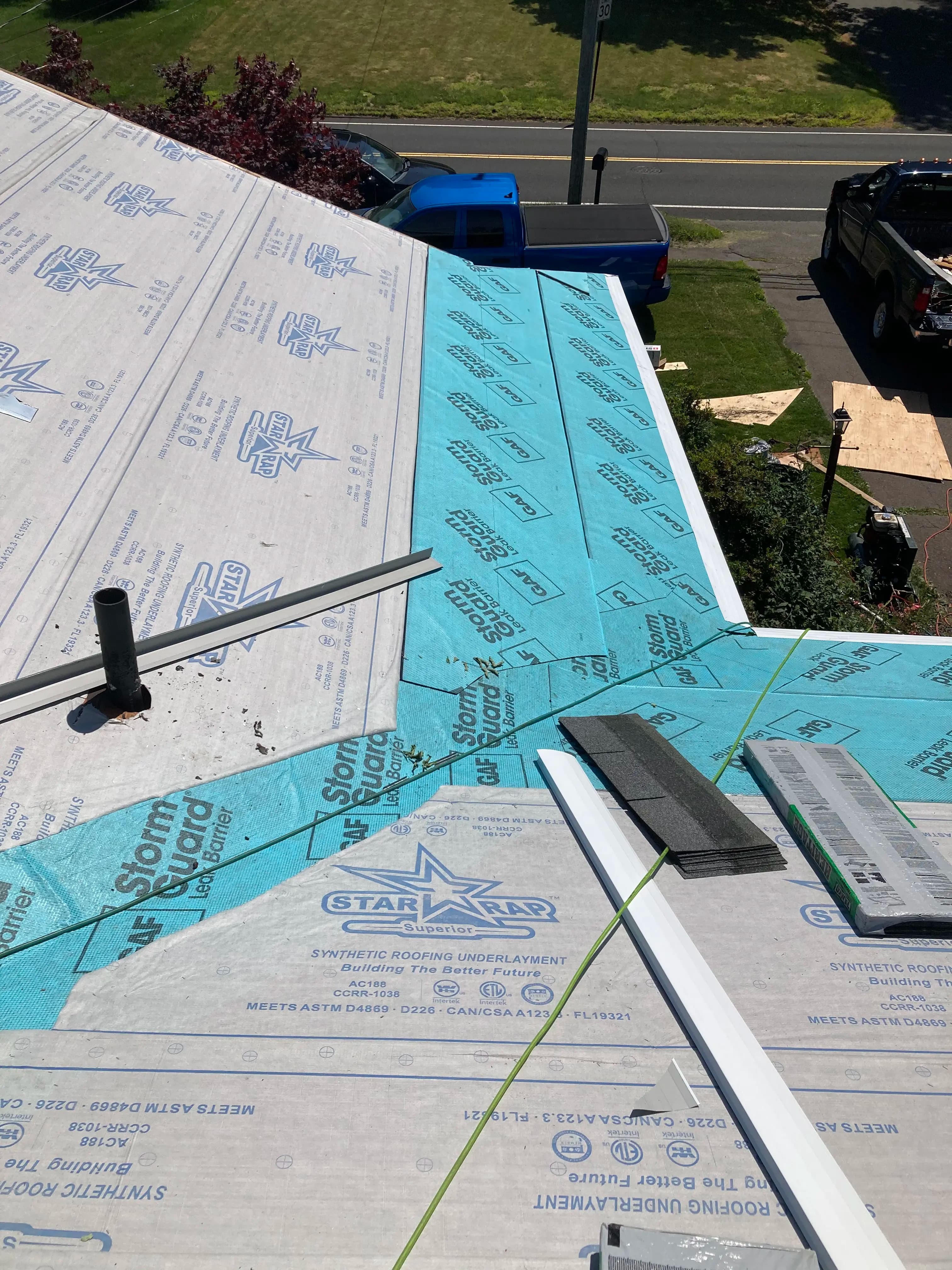 GAF StormGuard ice-and-water shield installed in a roof valley and along the eaves under synthetic underlayment on a Pattison Construction roof deck